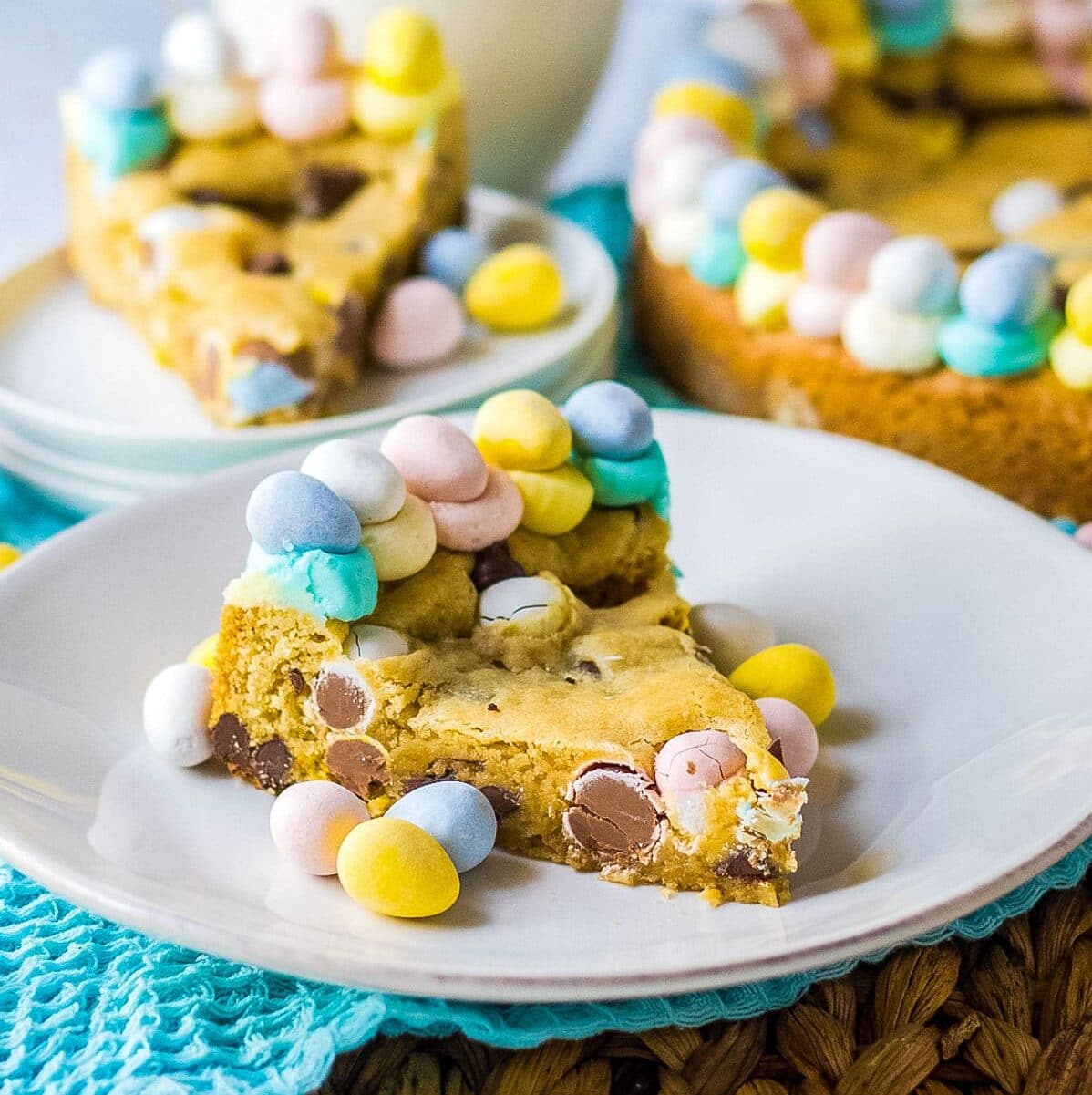 piece of cookie cake on a plate with easter eggs.
