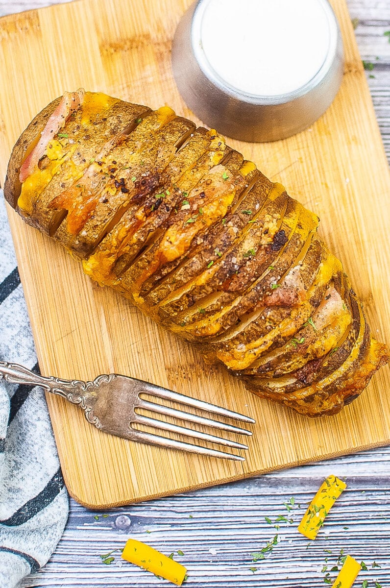 hasselback potato with bacon and cheese.
