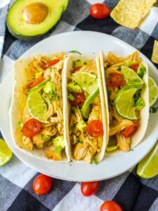 top view of slow cooker chicken tacos with honey lime sauce.