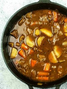 top view of Irish beef stew in a Dutch oven.