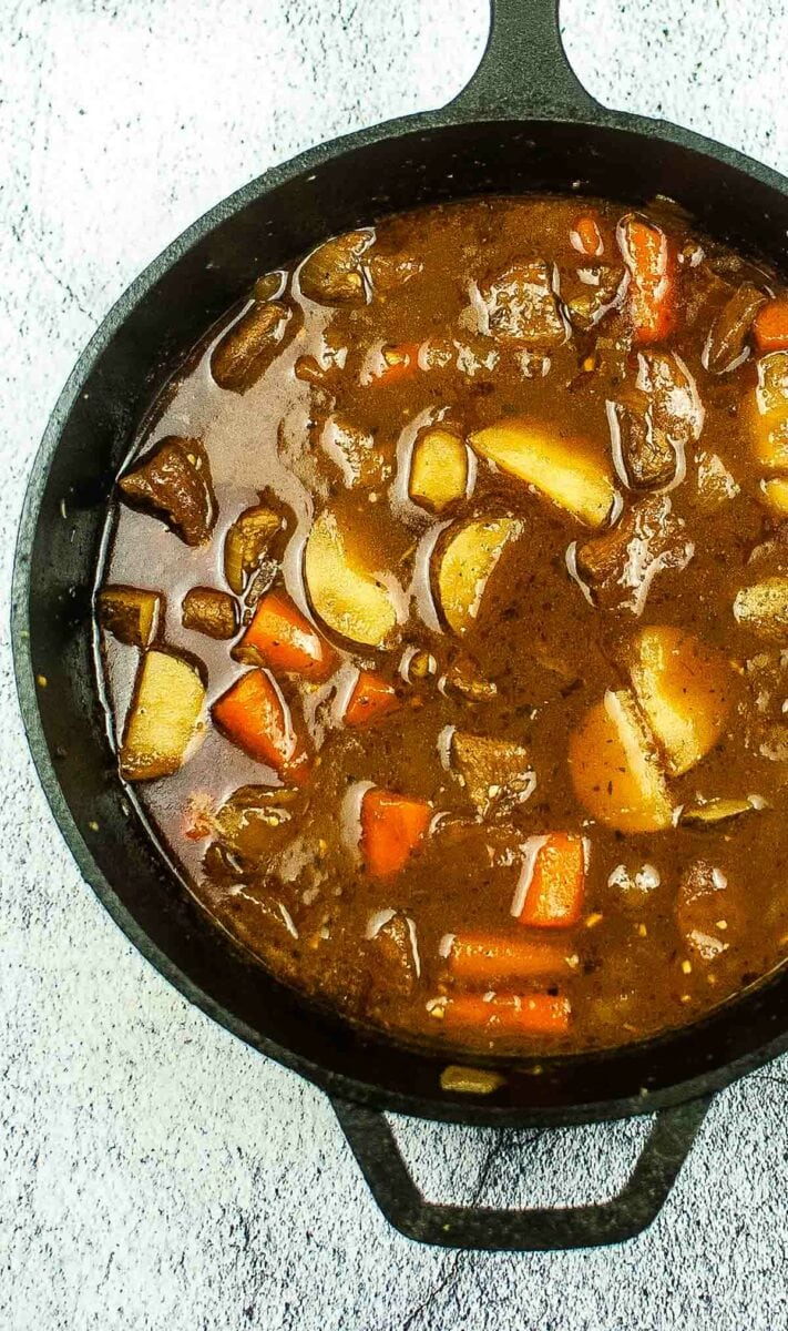 top view of Irish beef stew in a Dutch oven.