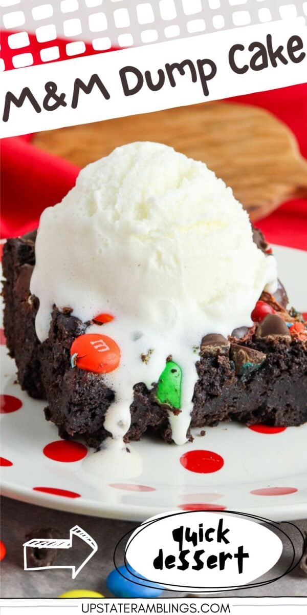 A slice of chocolate dump cake with M&Ms, topped with melting vanilla ice cream, served on a white plate with red polka dots.