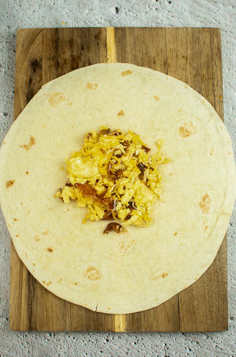 egg and bacon filling on a tortilla.