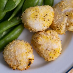 top view of air fryer sea scallops with light breading.