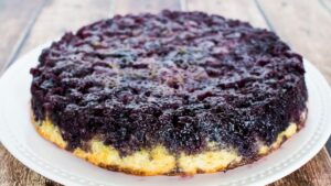 blueberry upside down cake on a platter.