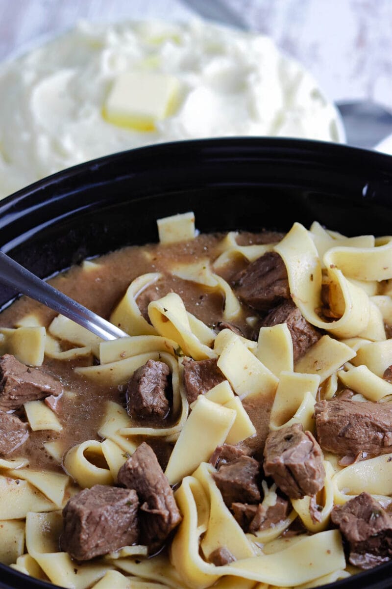 Serving the crock pot beef and noodles from the slow cooker.