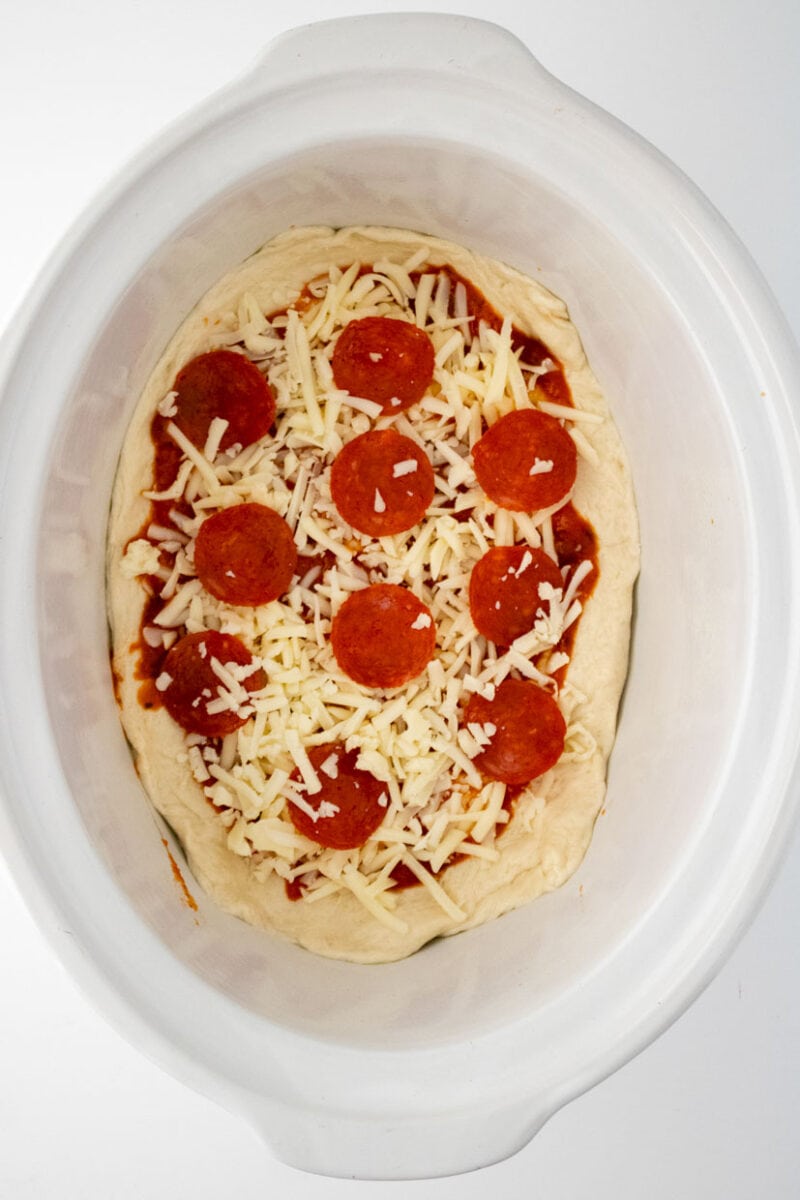 pizza with pepperoni and cheese in a slow cooker.