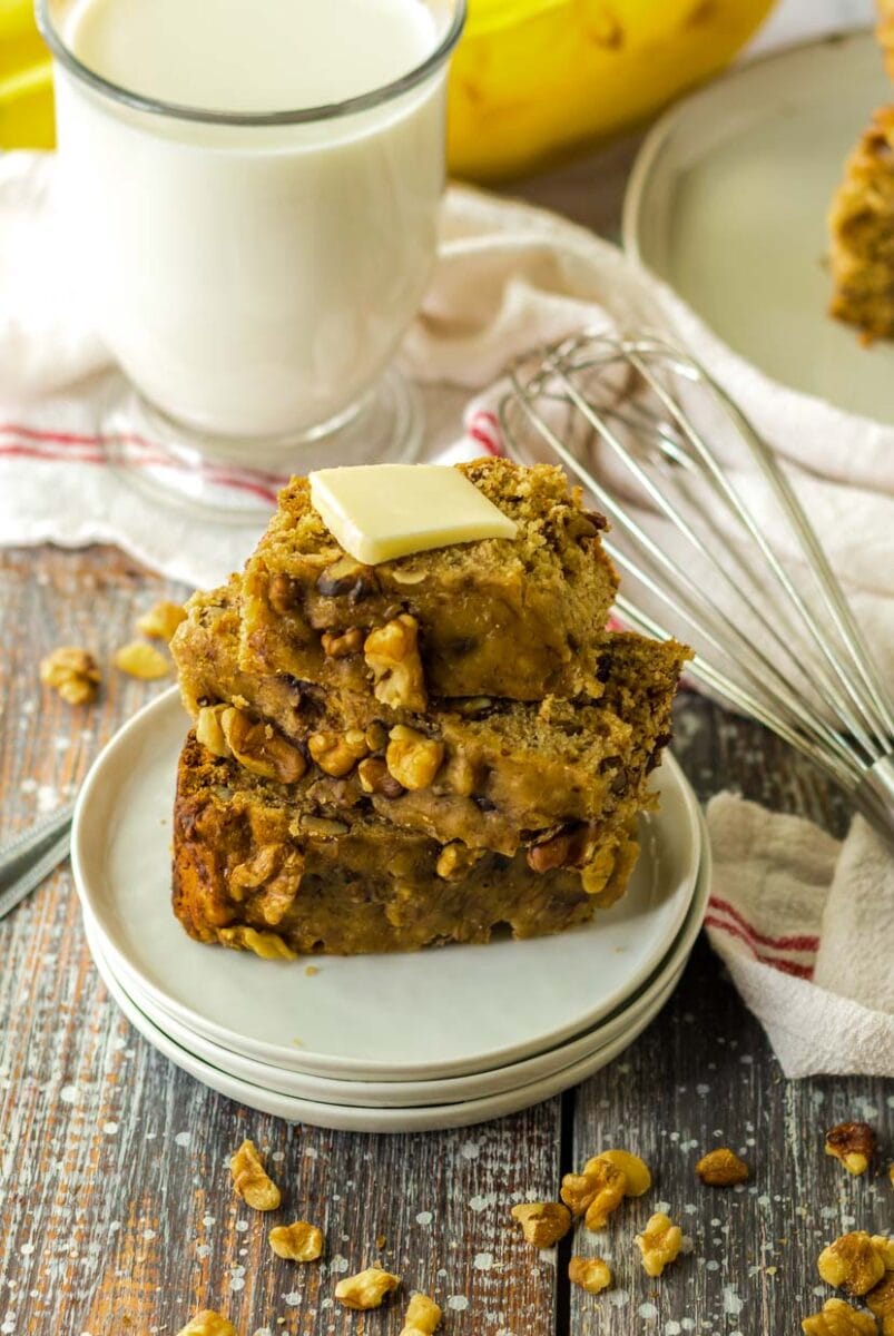 Stack of slow cooker banana bread topped with butter.
