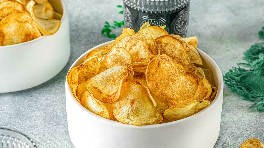 Side view of a bowl of air fryer potato chips.