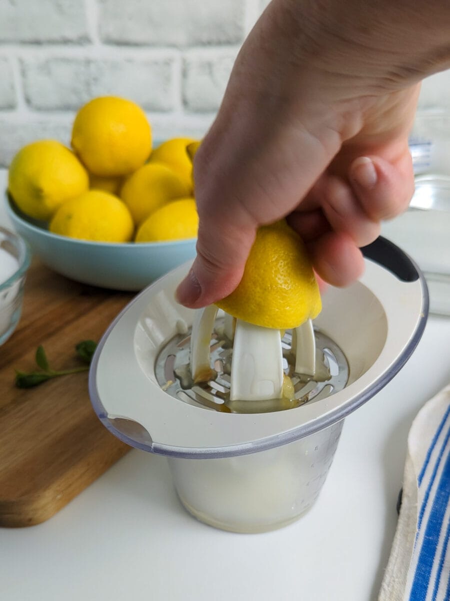 Juicing the lemons for lemonade.