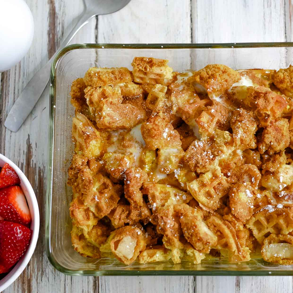 Piece of chicken and waffle casserole on a plate.