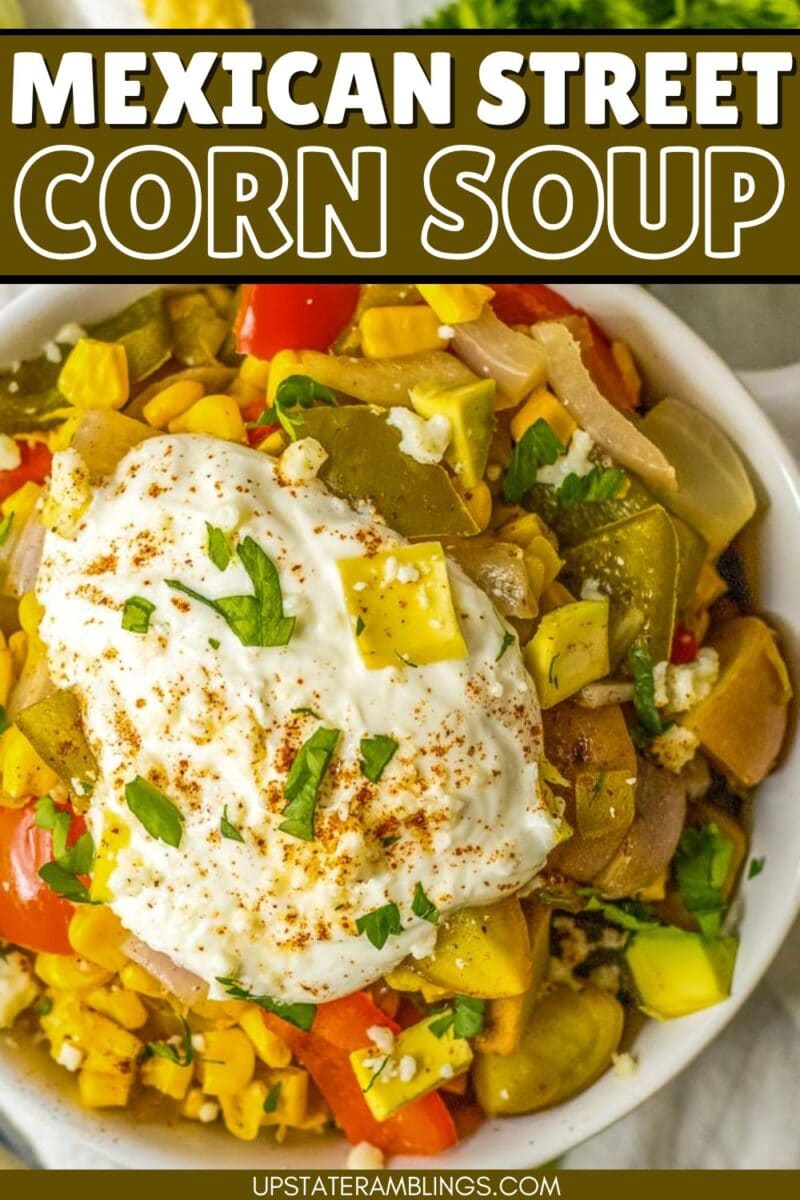 Bowl of Mexican street corn soup topped with a dollop of cream, chopped herbs, and sprinkled spices, brimming with visible corn, peppers, and onions for an authentic flavor experience.