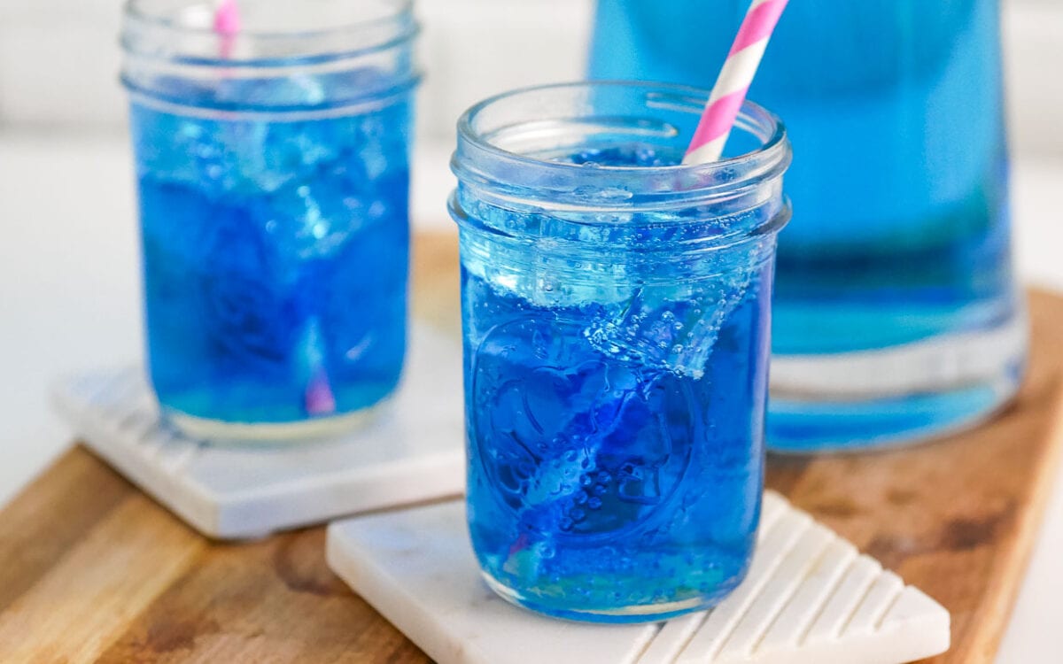 Glass of bright blue copycat sonic ocean water.