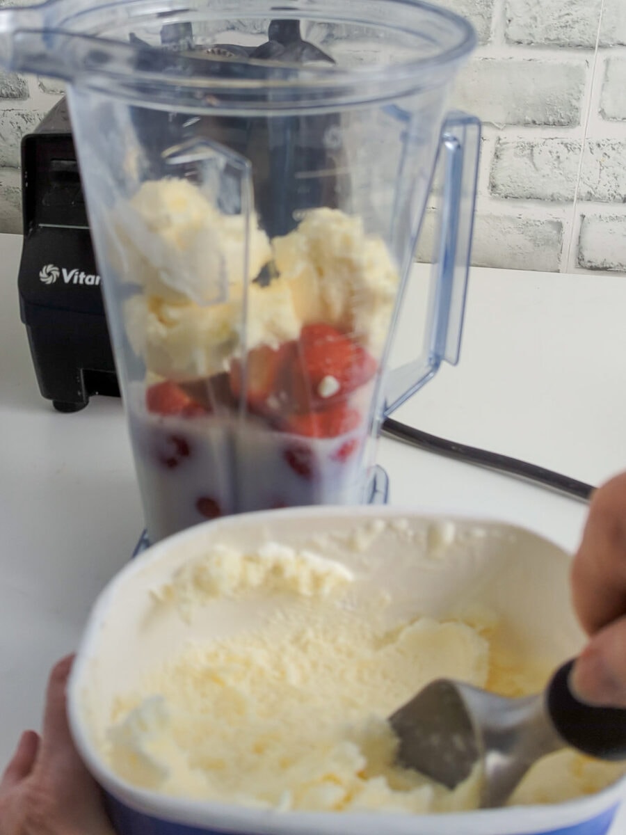 Adding the ice cream to the blender.