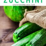 Pinterest image for how to freeze zucchini with a photo of zucchini in a bag.