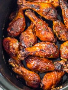 Chicken wings in a slow cooker.