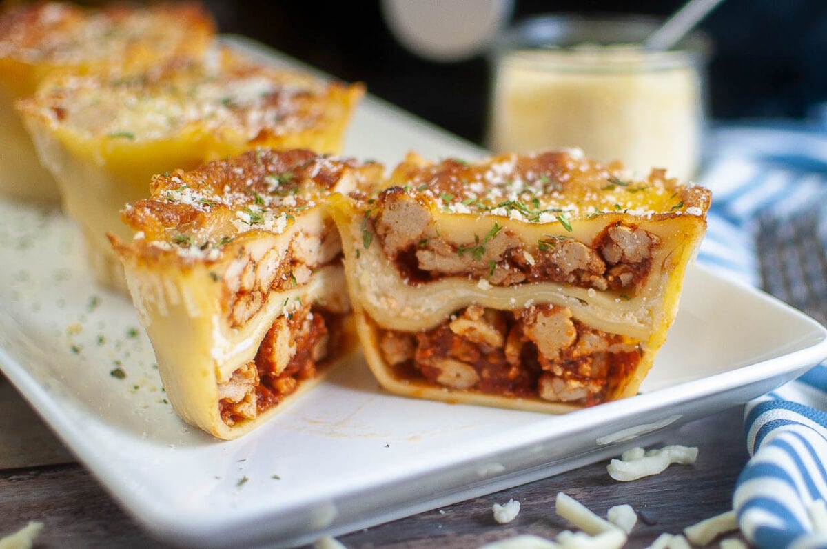 Sliced lasagna cups on a plate in closeup.