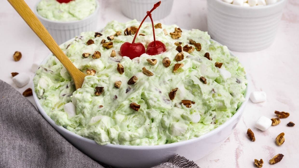 pistachio fluff salad in a bowl with a spoon.
