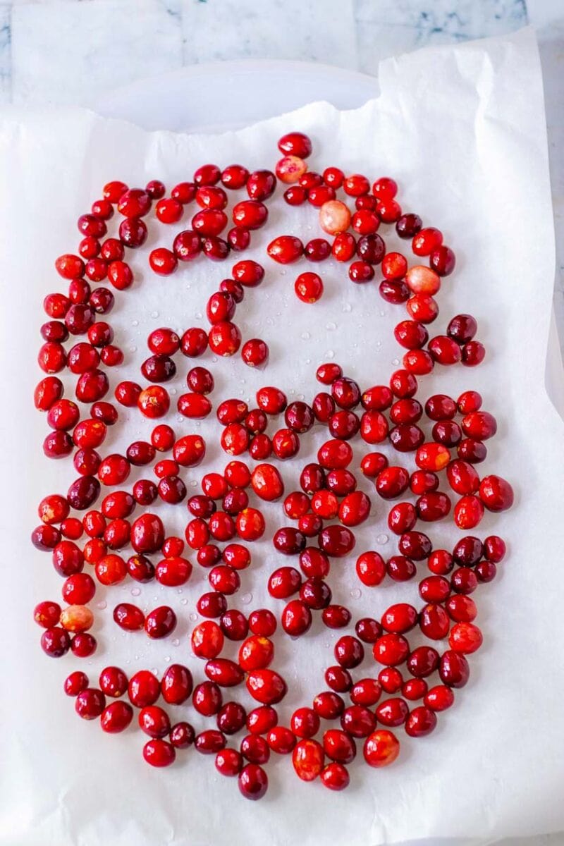 Cranberries drying after mixing in sugar syrup.