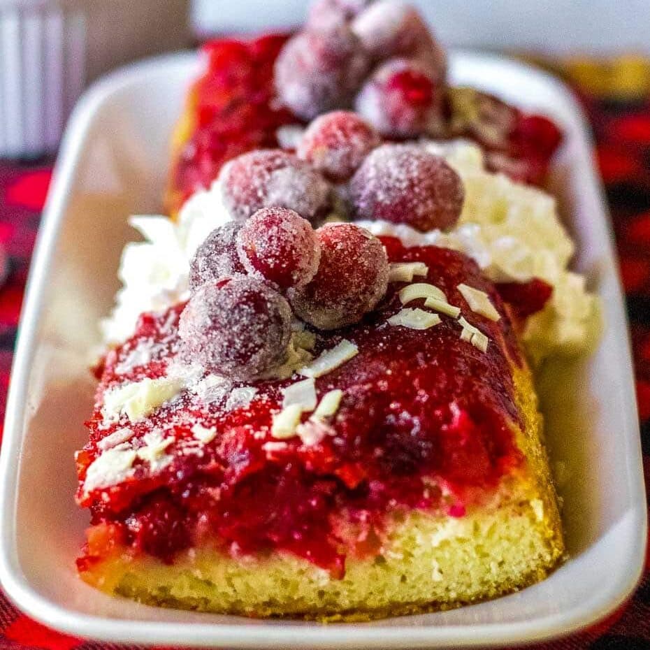 Cranberry upside down cake on a platter.