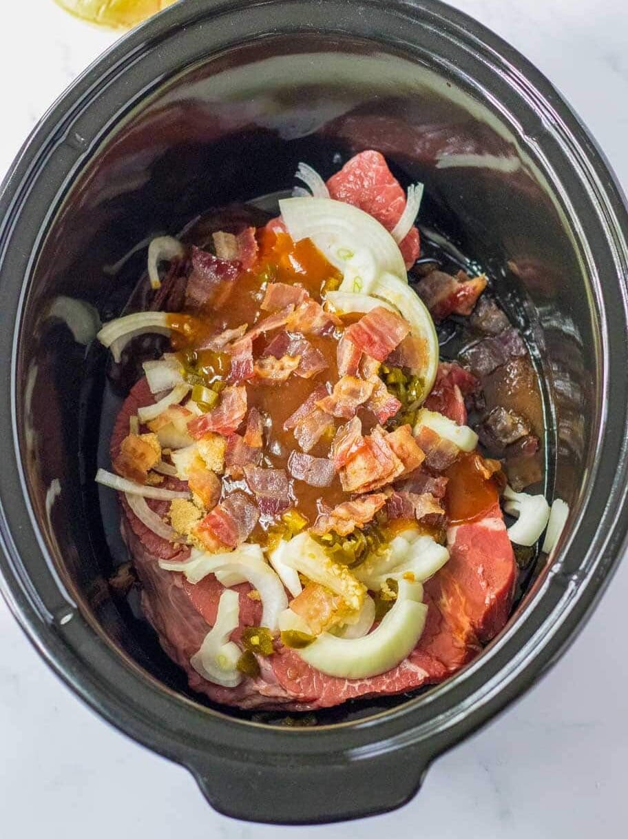 Ingredients for bbq beef in the crockpot before cooking.
