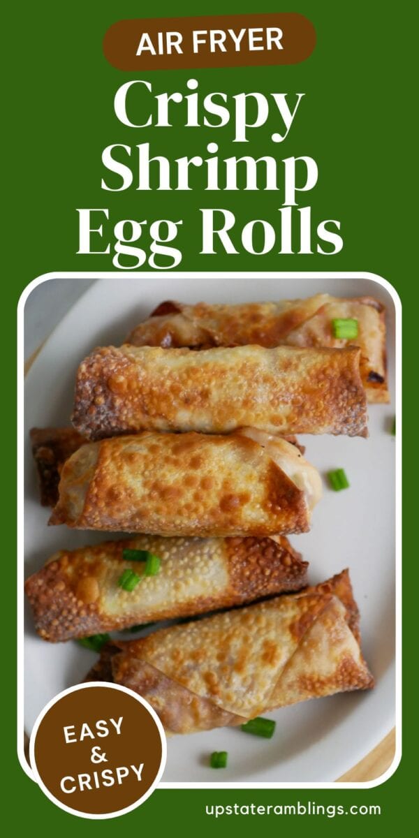 A plate of golden-brown shrimp egg rolls arranged in a row, garnished with chopped green onions. Text overlay reads “Air Fryer Crispy Shrimp Egg Rolls – Easy & Crispy.” Perfect for shrimp egg rolls lovers craving a crispy treat!.