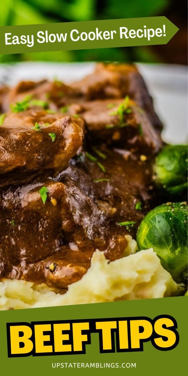 Close-up of slow cooker beef tips with rich brown gravy, served alongside mashed potatoes and Brussels sprouts. Text reads “Easy Slow Cooker Recipe! Beef Tips.”.