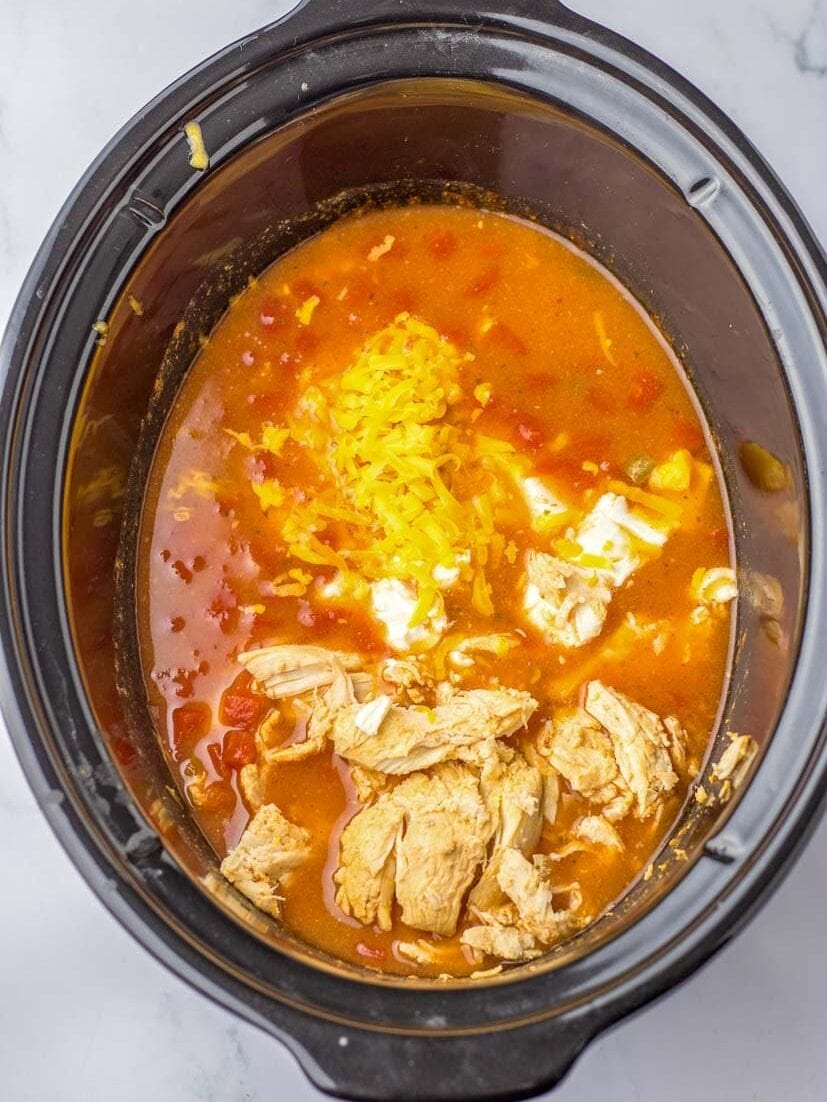 Slow cooker Buffalo chicken chili with ingredients mixed.