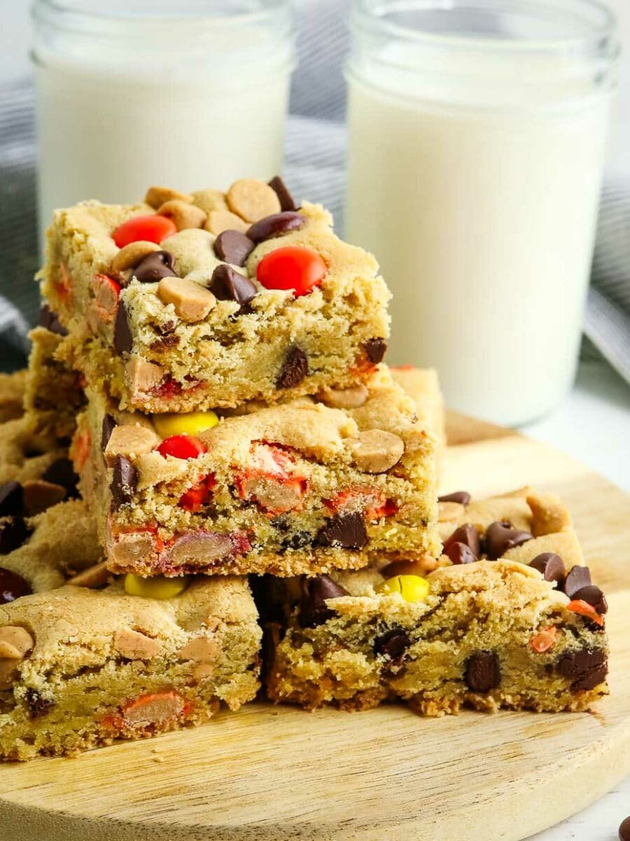 Peanut butter cookie bars on a wooden cutting board.