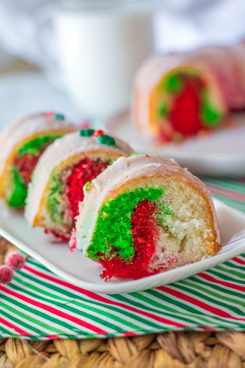 A festive bundt cake adorned with red and green sprinkles, perfect for Christmas celebrations.