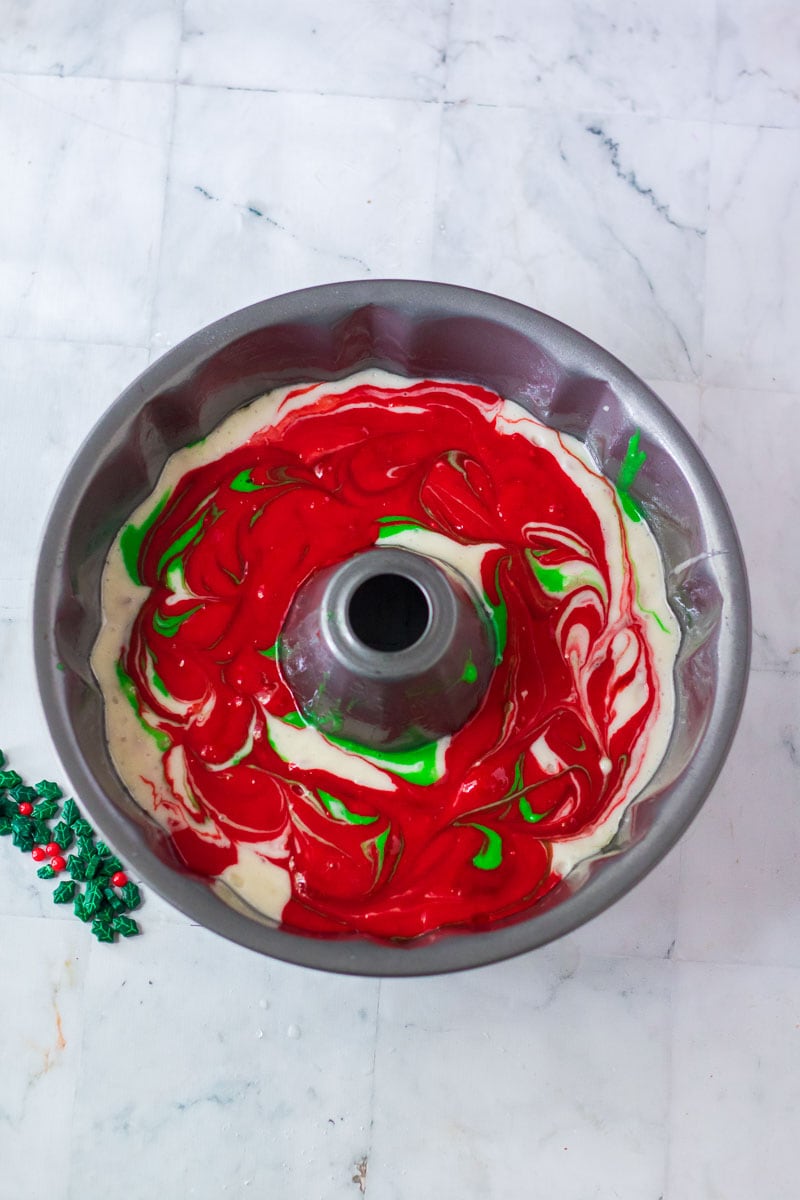 A Christmas bundt cake pan with red and green swirled icing.