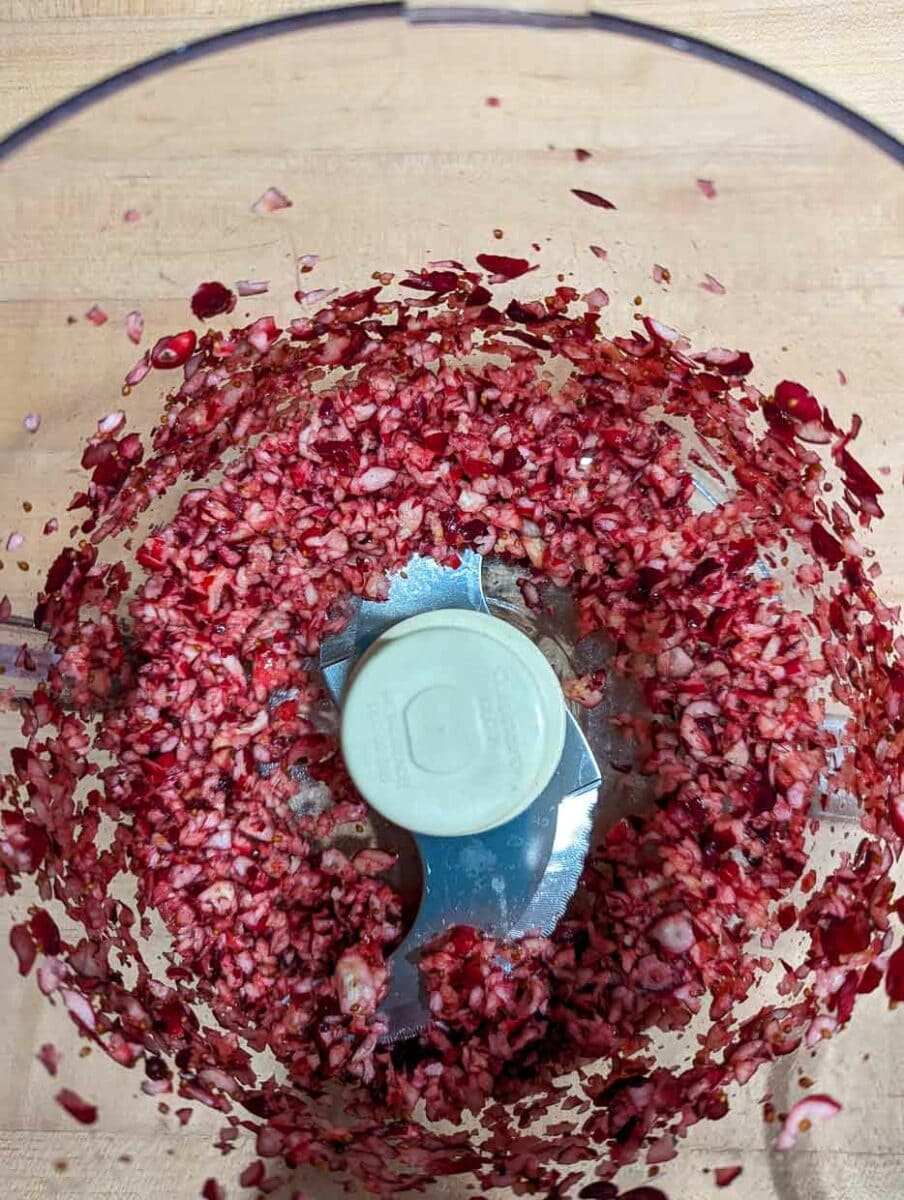 Pomegranate seeds in a food processor.