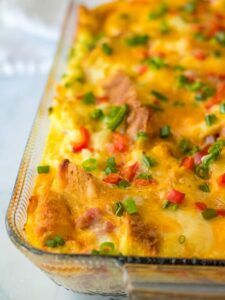 Ham and cheese breakfast casserole in a glass dish.