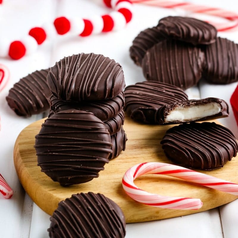closeup of homemade peppermint patties with a candy cane