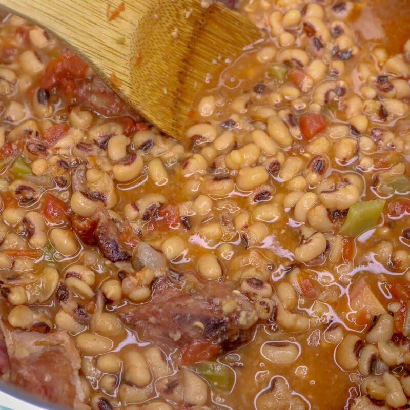 wooden spoon in big container of Instant Pot black eyed peas