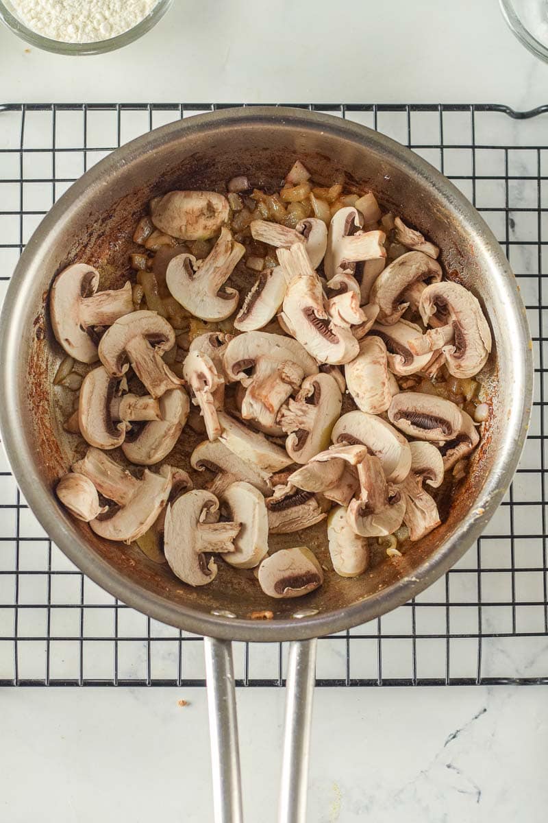 Chicken Stroganoff with mushrooms cooked in a pan.
