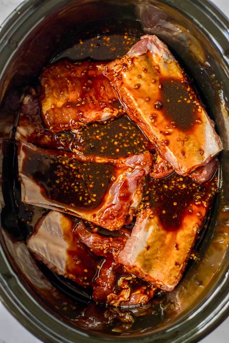 Asian inspired pork ribs in a slow cooker.