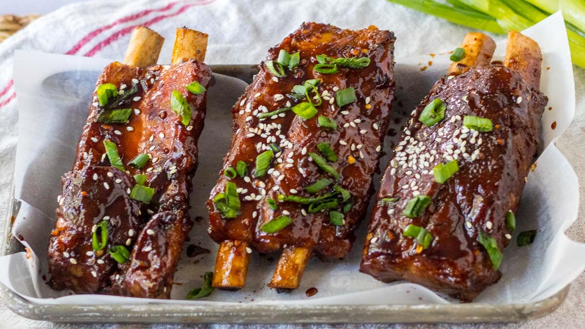 Bbq ribs with sesame seeds and green onions.