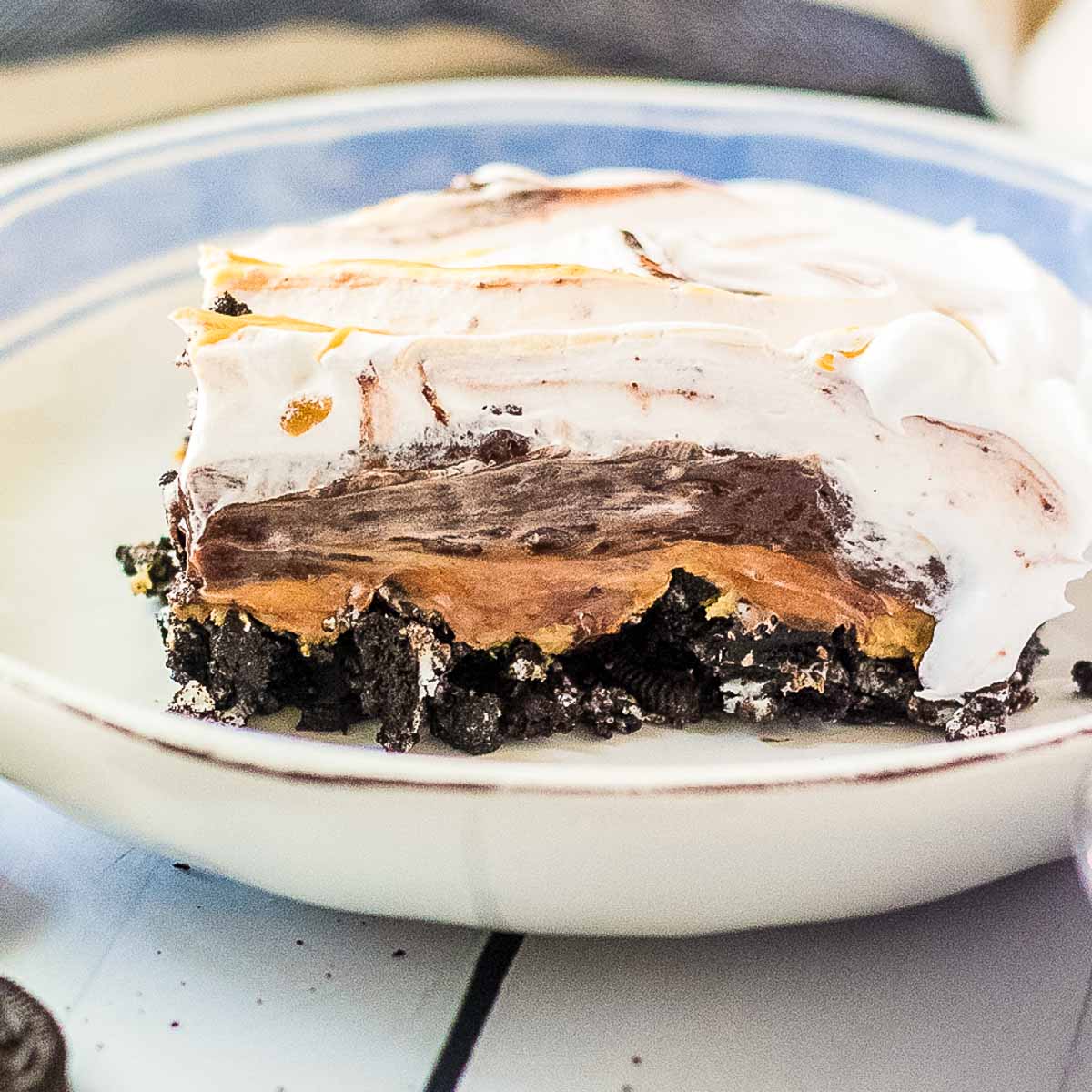 A piece of peanut butter oreo pie on a plate.