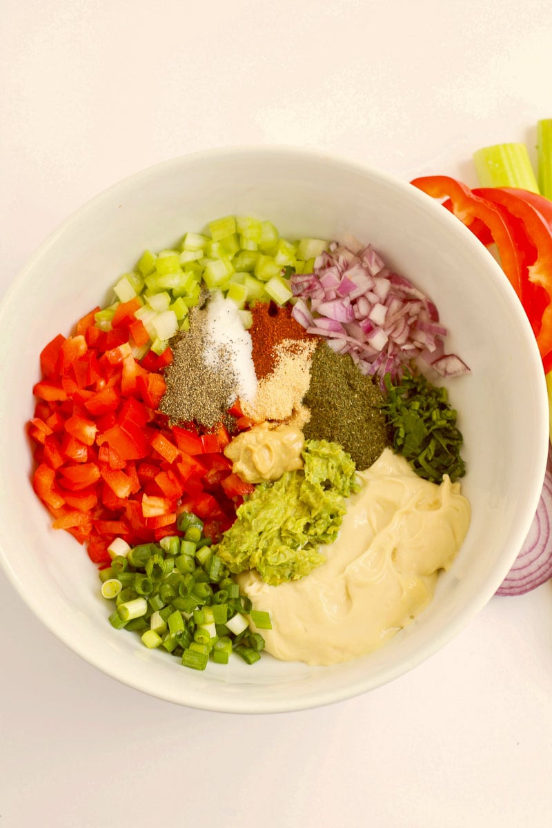 A white bowl with various ingredients in it.