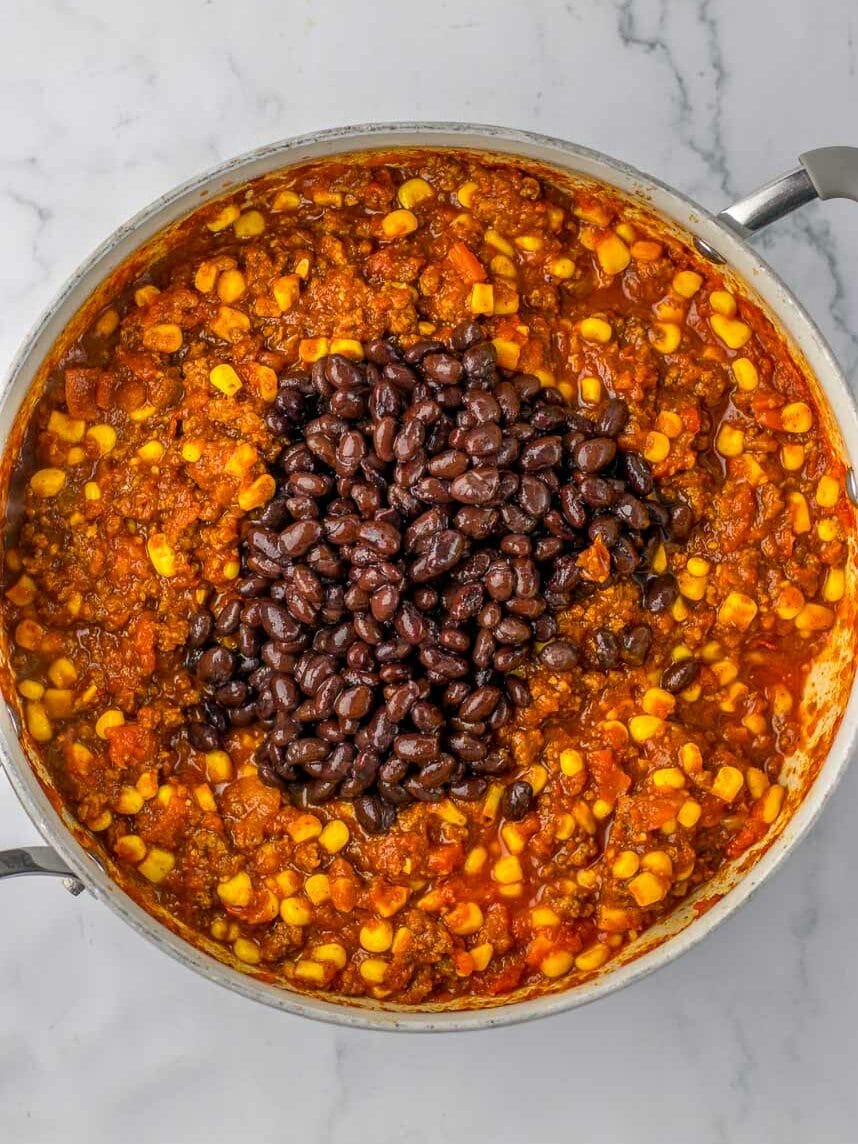 A pan full of black beans and corn.