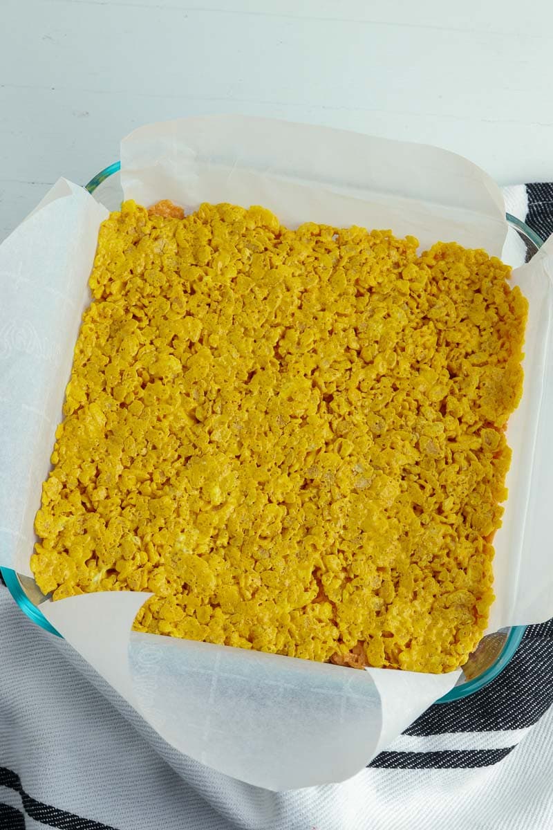 A baking dish with a yellow granola in it.