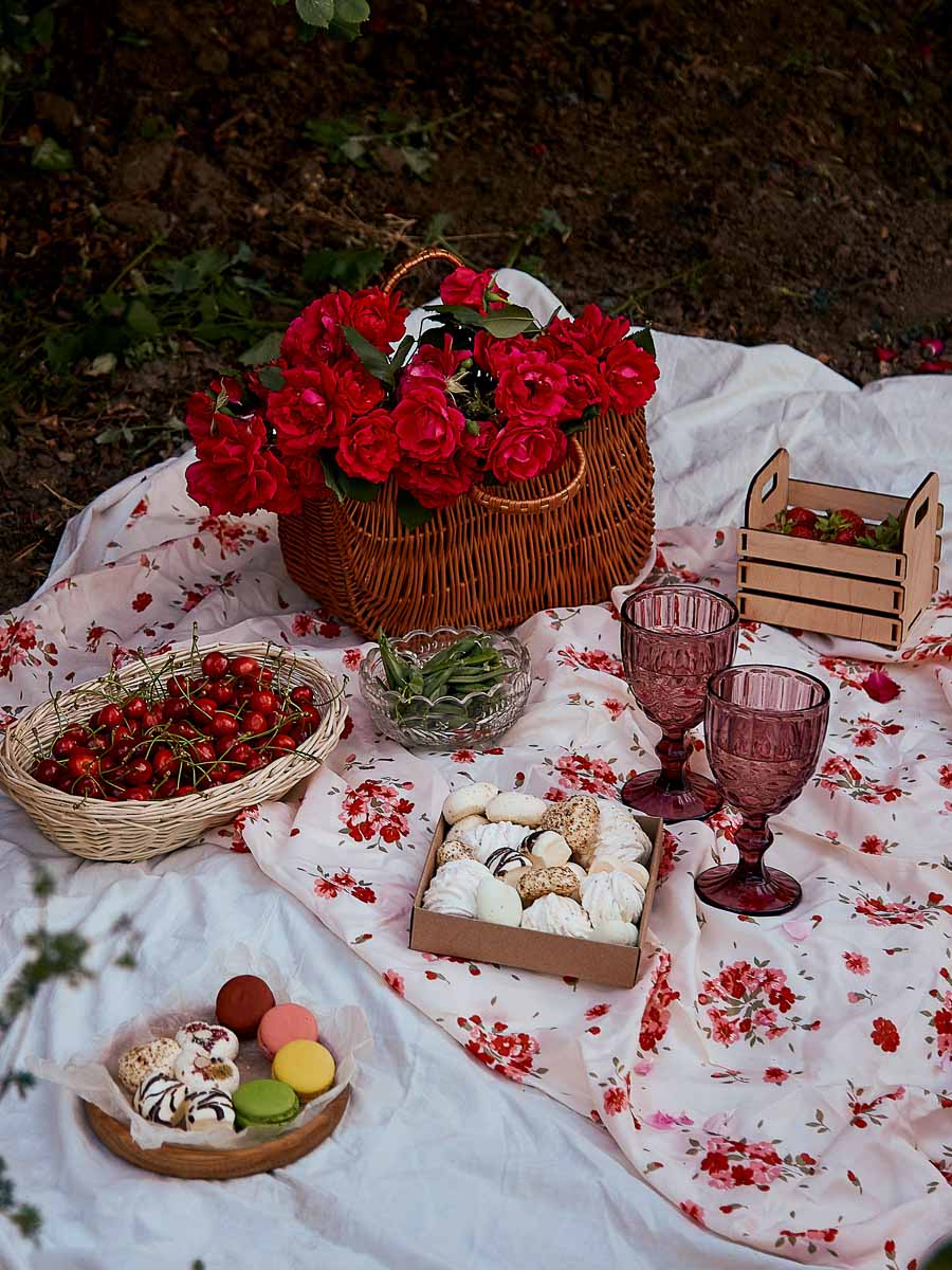 Aesthetic Picnic: A picnic in the woods with a basket of food and flowers.