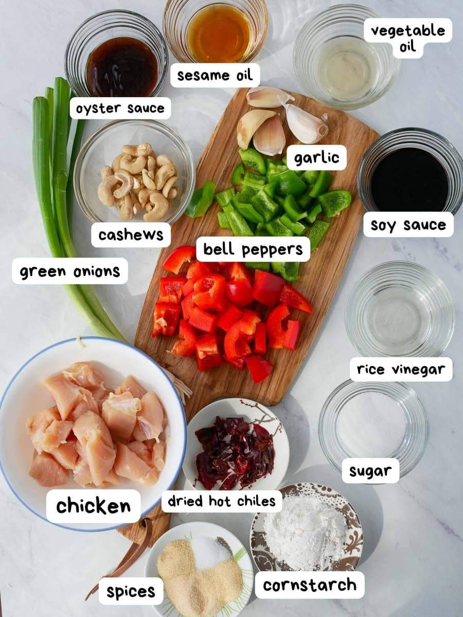 A cutting board with ingredients for Kung Pao Chicken.