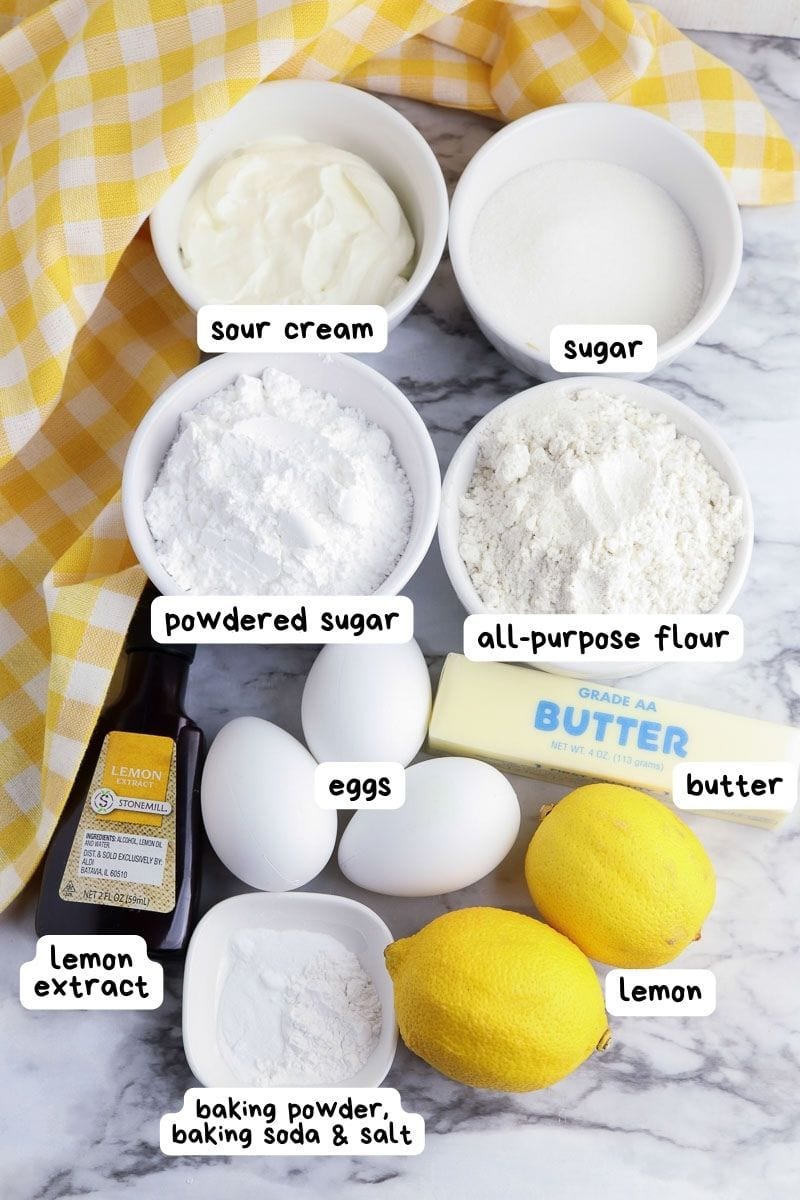 Ingredients for a lemon loaf on a marble table.