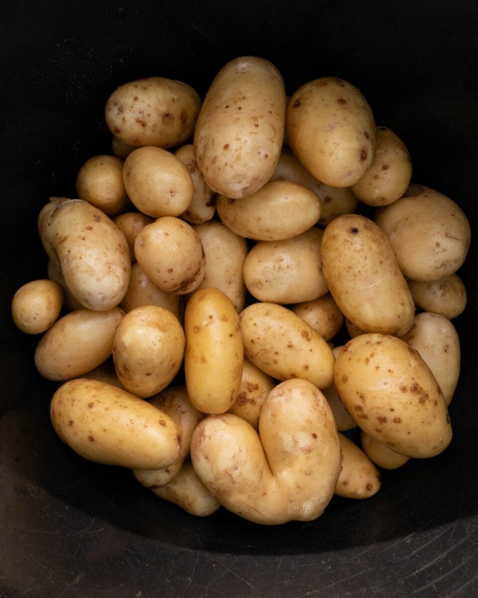 A close up of potatoes in a bowl.