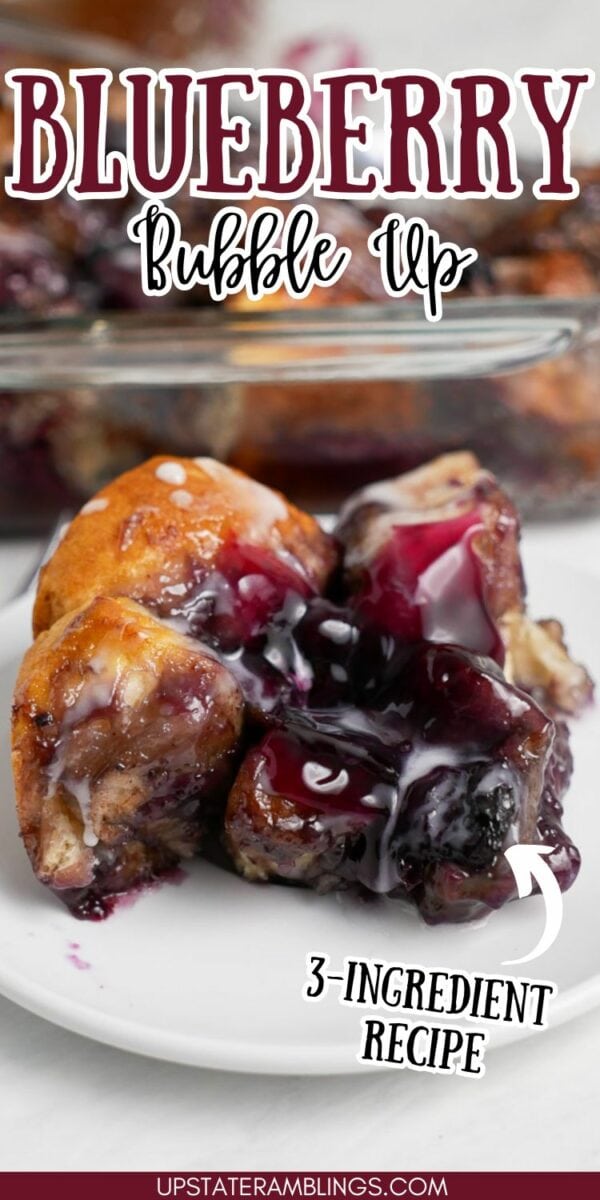 A close-up of blueberry bubble up on a plate, topped with a white drizzle. The text above reads "Blueberry Bubble Up," and below it says "3-Ingredient Recipe.