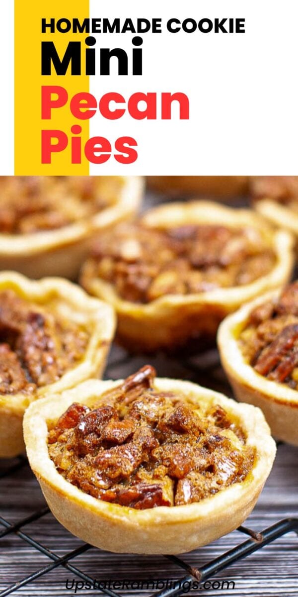 Mini pecan tassies with flaky crusts are displayed on a cooling rack, showcasing their homemade, cookie-sized design.