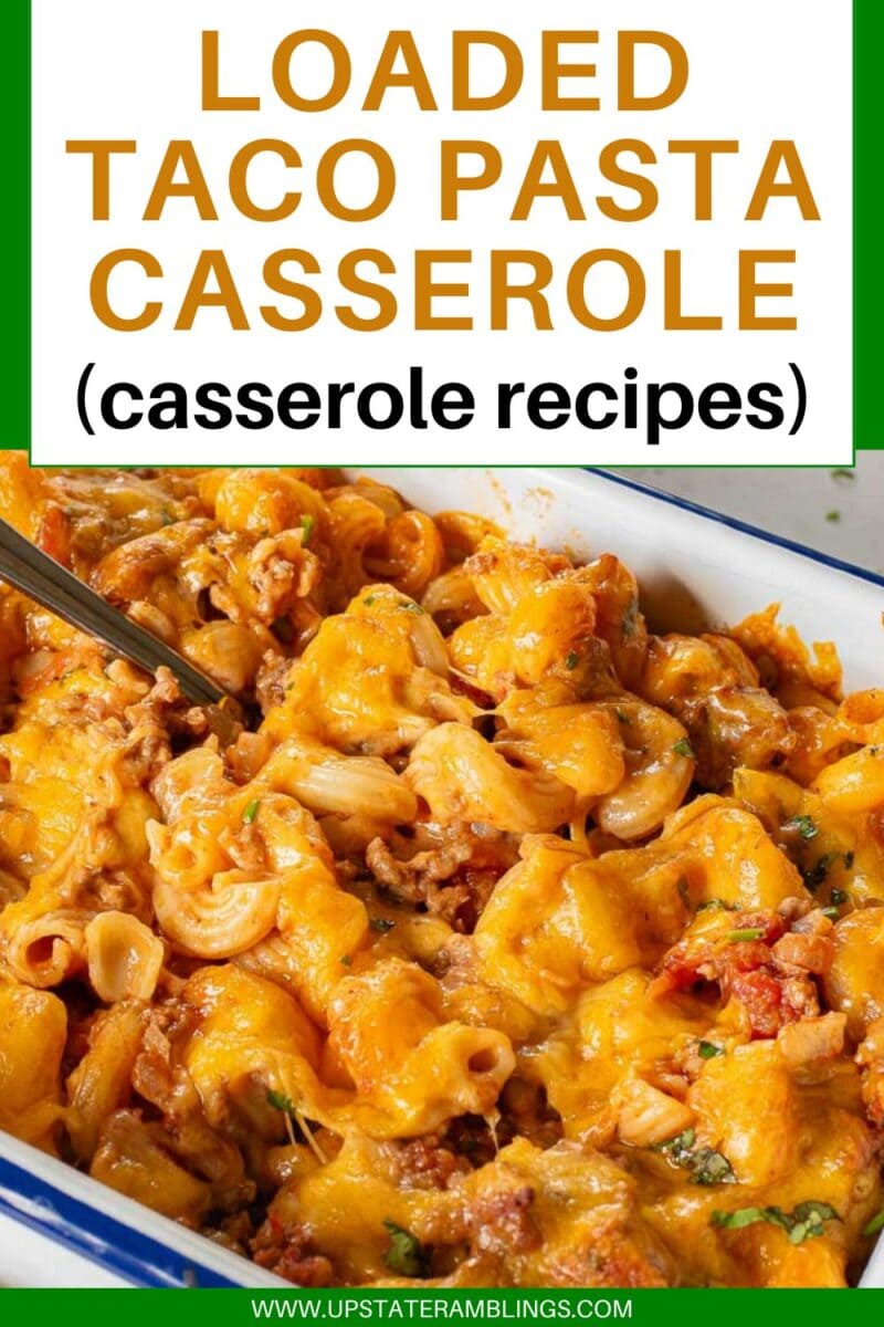 A cheesy taco pasta casserole is baked to perfection and served in a rectangular dish, ready to enjoy with a spoon.