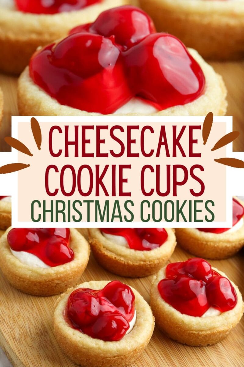 Cherry cheesecake cookie cups topped with cherry pie filling are arranged on a wooden surface, with a sign that reads "Cheesecake Cookie Cups Christmas Cookies.